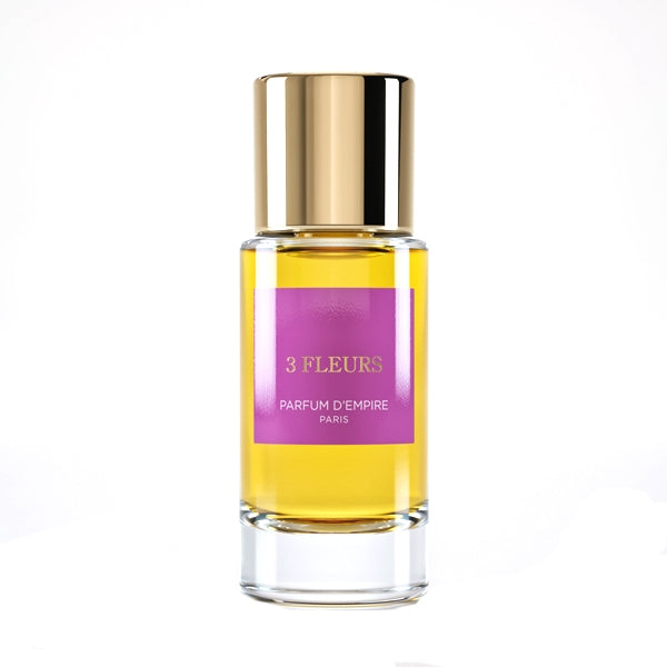 Parfum d'Empire - 3 Fleurs klarer Glasflakon mit goldfarbenem Verschluss und auffälligem violettem Etikett vor weißem Hintergrund