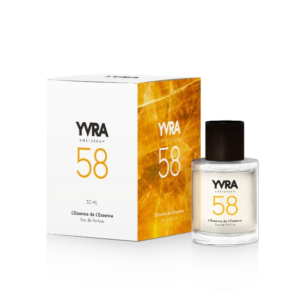 YVRA - YVRA 58 L'Essence de L'Essence Glasflakon mit schwarzem Verschluss neben weißer und goldener Verpackung