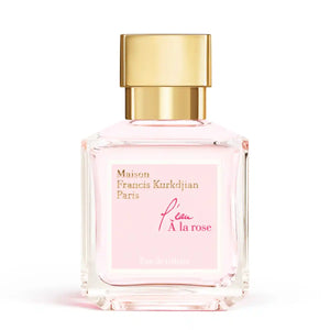 Maison Francis Kurkdjian Paris - l'eau À la rose Parfumflakon mit zart rosa Flüssigkeit und goldfarbenem Verschluss vor weißem Hintergrund
