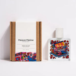 Maison Matine - Arashi no Umi Parfumflakon mit farbenfroher Insel- und Blumengrafik auf klarem Glas neben schlichter Verpackung