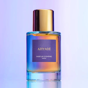 Parfum d'Empire - Aziyadé Flakon mit goldenem Verschluss und farblich changierendem Glas vor hellem Hintergrund