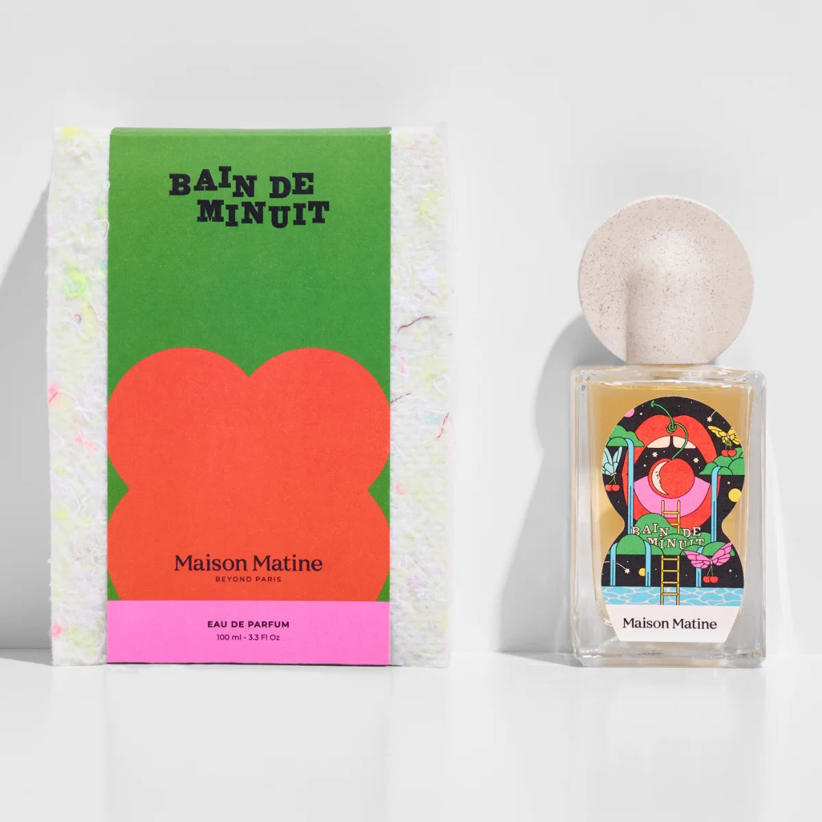 Maison Matine - Night Fever Collection - Bain de Minuit zeigt Flakon mit farbenfroher Grafik und natürlichem runden Verschluss auf weißem Grund