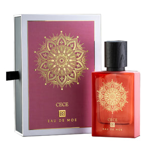 Eau De Moe - Cece Parfum in Koralle mit filigranem goldenen Mandala und schwarzem Holzverschluss neben edler Verpackung