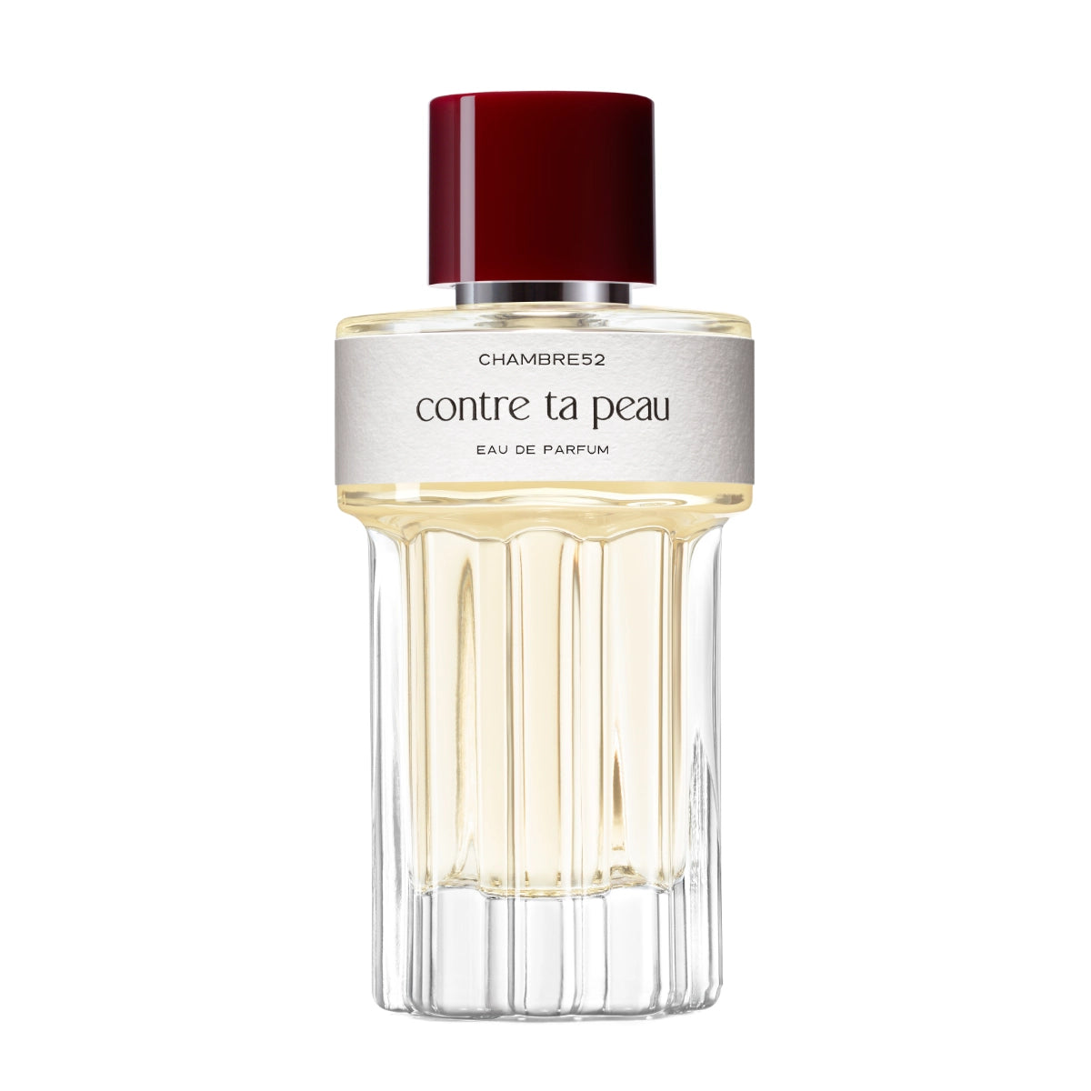 Chambre52 - Contre ta Peau zeigt eleganten Flakon mit hellem Parfum und tiefrotem Verschluss vor weißem Hintergrund