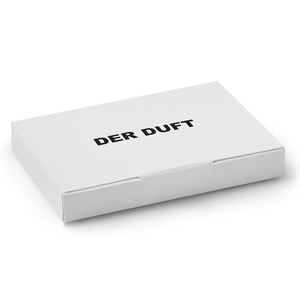 DER DUFT - Discovery Set in schlichter weißer Verpackung mit schwarzer Schrift auf mattem Karton