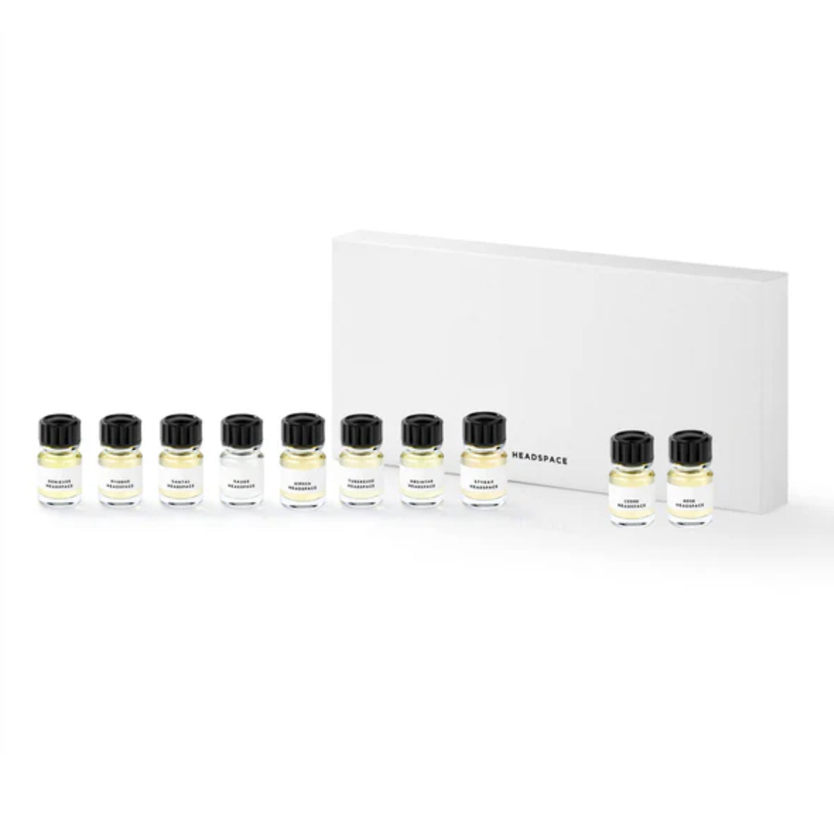 Headspace - Discovery Set mit zehn kleinen Parfumproben in klaren Fläschchen vor weißem Hintergrund minimalistisch präsentiert
