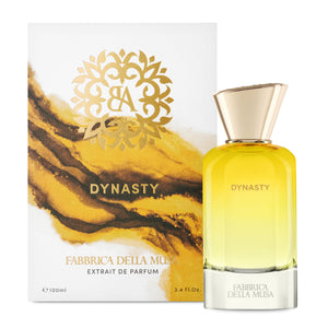 Fabbrica della Musa - Dynasty Duftflakon mit goldenem Verschluss und gelb verlaufendem Glas vor dekorativer Verpackung
