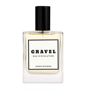 Gravel - Eau D'Evolution Parfumflakon mit klarem Glas und schwarzem Verschluss vor weißem Hintergrund