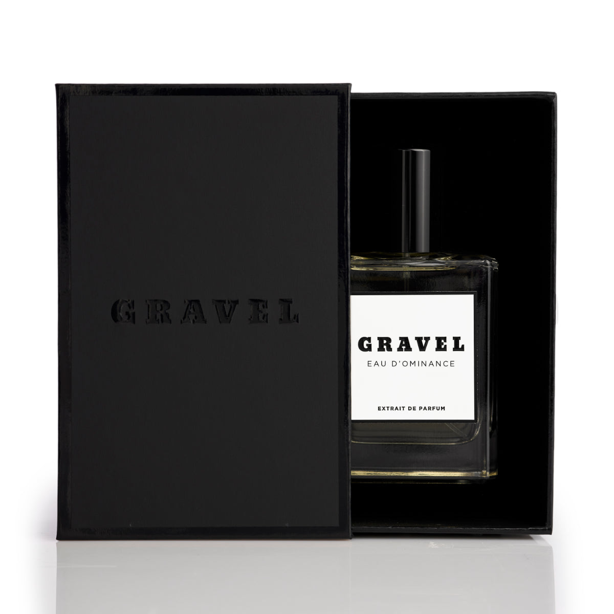 Gravel - Eau D'Ominance Extrait de Parfum Flakon in schwarzer Box mit reduziertem Design vor weißem Hintergrund