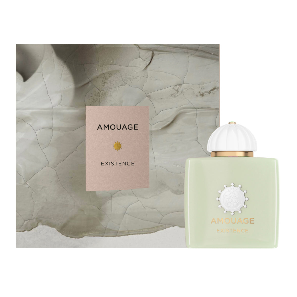 Amouage - Existence Parfumflakon in hellem Grün mit goldener Prägung und verspieltem weißem Verschluss vor Marmorhintergrund