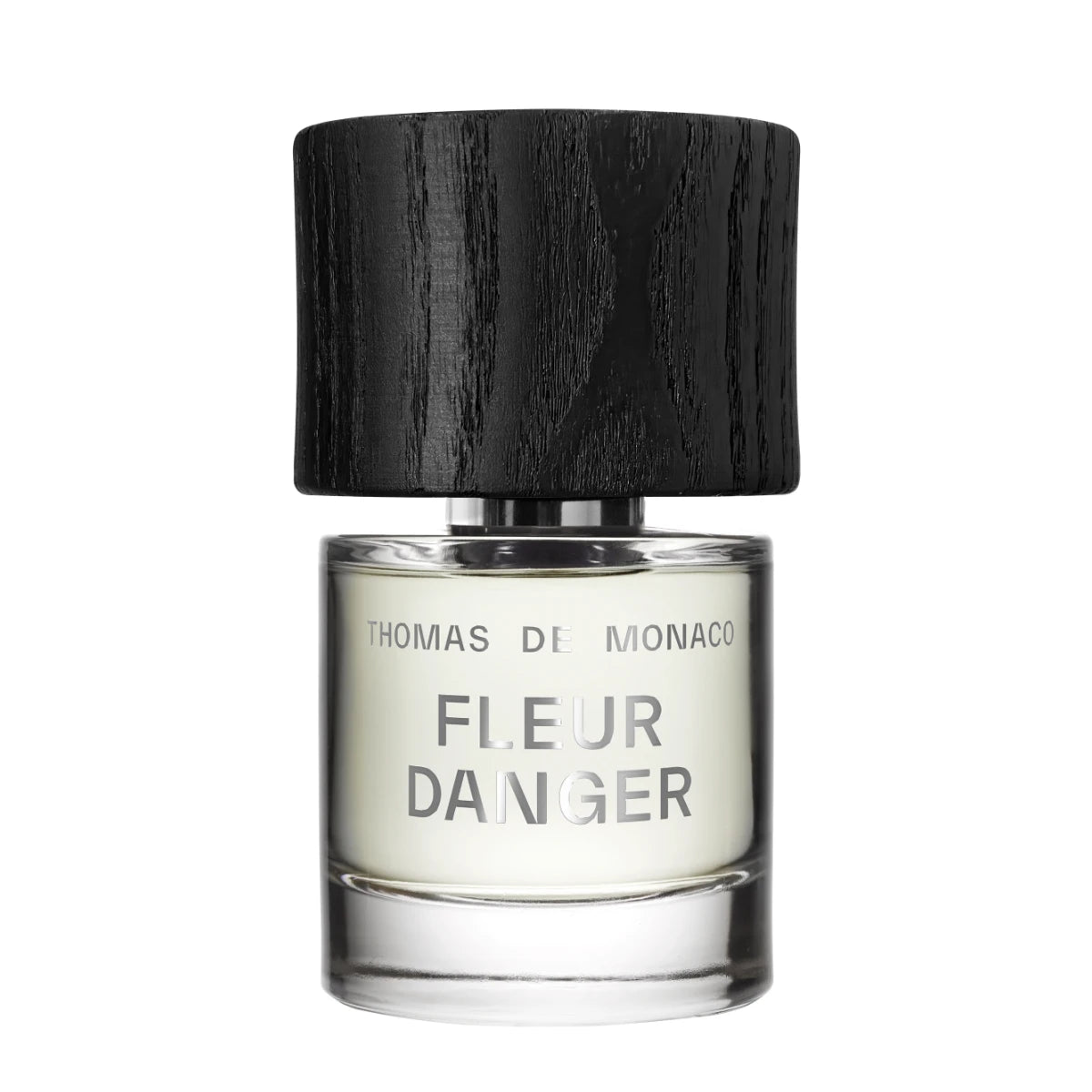 Thomas de Monaco - Fleur Danger zeigt minimalistischen Flakon mit schwarzem Holzdeckel und schlichtem Schriftzug auf klarem Glas