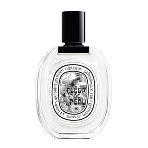 Diptyque - Fleur de Peau - Eau de Toilette in klarem Glasflakon mit schwarzem Verschluss und verspieltem Etikettendesign