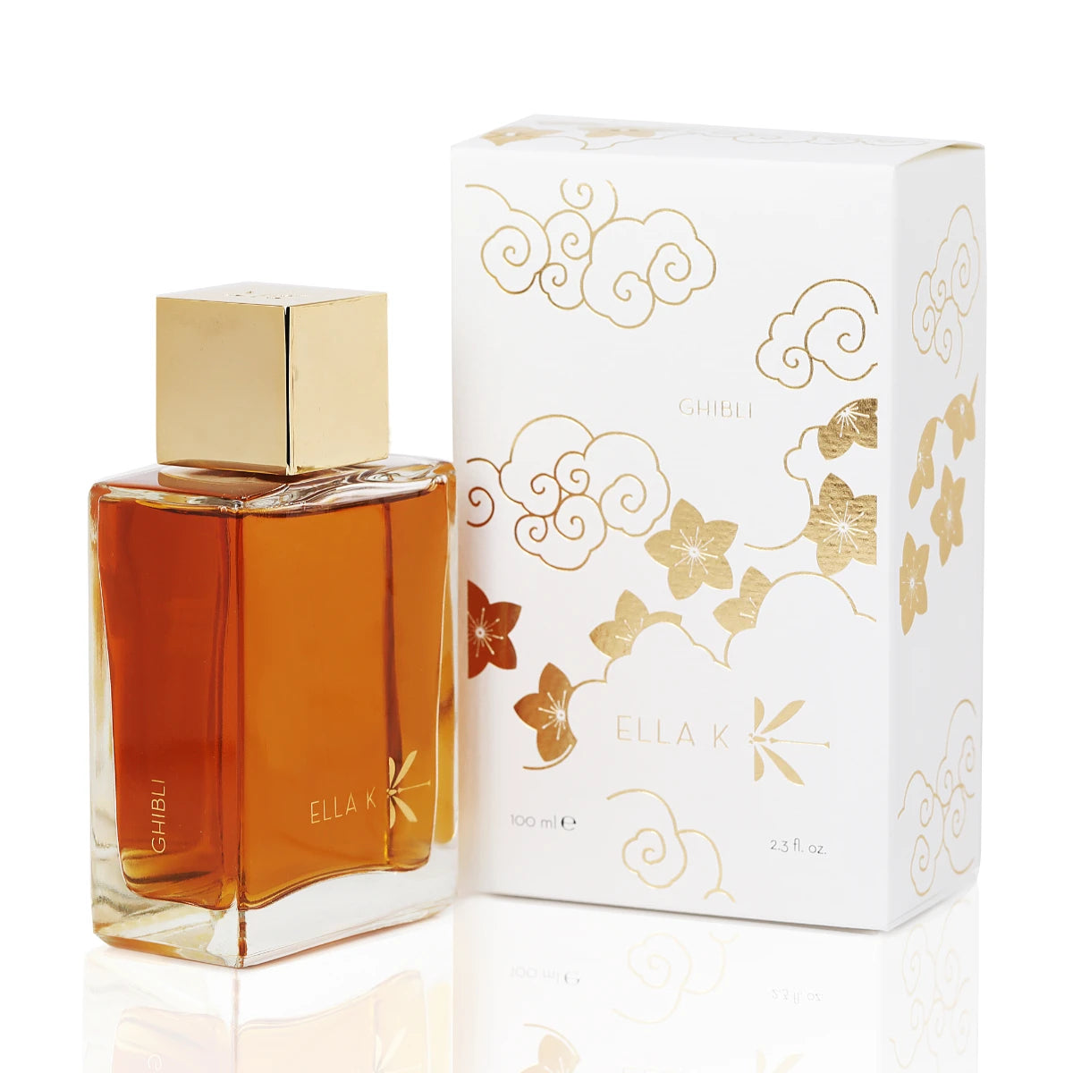 Ella K - Ghibli Flakon mit bernsteinfarbener Flüssigkeit und elegante Verpackung mit goldenen Wolken- und Blumenmotiven