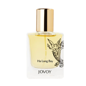 Jovoy - Ha Long Bay klarer Flakon mit goldenem Verschluss und filigranem Engelsmotiv vor weißem Hintergrund