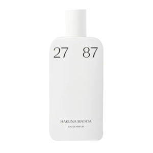 27 87 Perfumes - Hakuna Matata mit schlicht minimalistischem weißen Flakon und eleganter schwarzer Schrift auf hellem Hintergrund