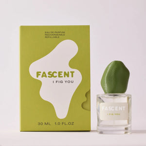 Fascent - I Fig You Parfumflakon mit grünem, organisch geformtem Deckel und passender Verpackung vor hellem Hintergrund