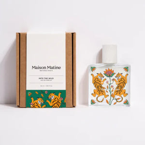 Maison Matine - Into the Wild Parfum mit lebendigem Tigermotiv und floralen Mustern auf klarem Glas und Verpackung
