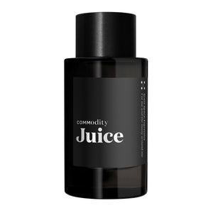 Commodity - Juice schwarzer Flakon mit schlichtem Etikett und modernem Design vor weißem Hintergrund