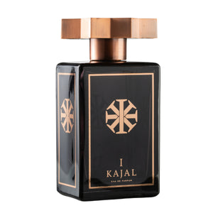 Kajal - Kajal I Parfumflakon in schwarzem Glas mit goldfarbenem Design und markantem achteckigem Verschluss vor weißem Hintergrund