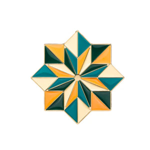 Kajal - Kolada Parfumflakon mit farbenfrohem geometrischem Mosaikmuster in Türkis, Gelb und Creme auf weißem Hintergrund