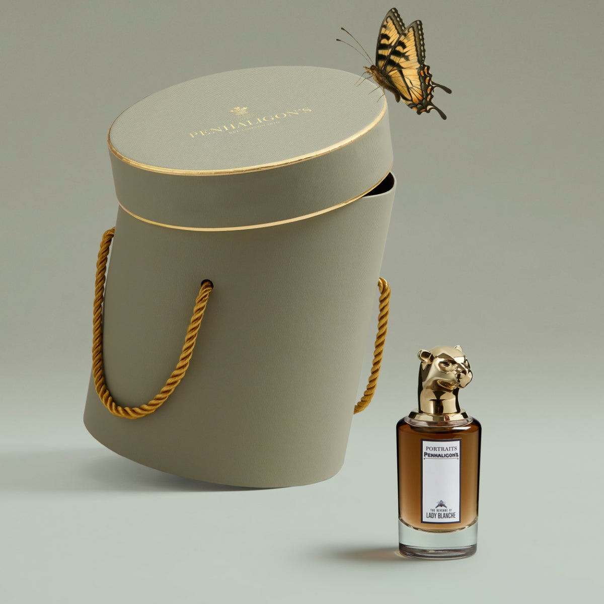 Penhaligon's - Portraits - The Revenge of Lady Blanche Parfümflakon mit elegantem Tierkopf neben edler grauer Verpackung