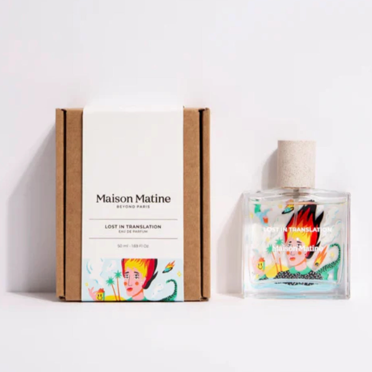 Maison Matine - Lost in Translation Parfumflakon mit farbenfroher abstrakter Illustration neben schlichtem Karton