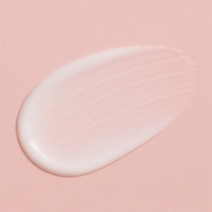 Philip B - Weightless Miracle Serum cremige Textur in sanftem Rosa auf hellem Hintergrund für leichte Pflege und Glanz