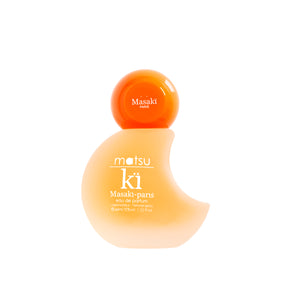 Masakï Matsushïma - Matsu Kï Parfumflakon in geschwungener Form mit leuchtend orangefarbenem Deckel auf weißem Hintergrund