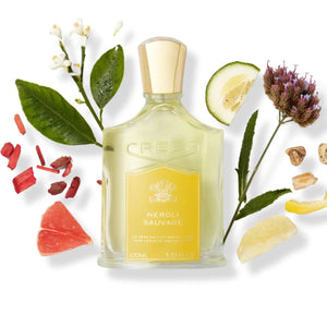Creed - Neroli Sauvage Parfumflakon mit goldfarbenem Verschluss und natürlichen Duftnoten auf weißem Hintergrund