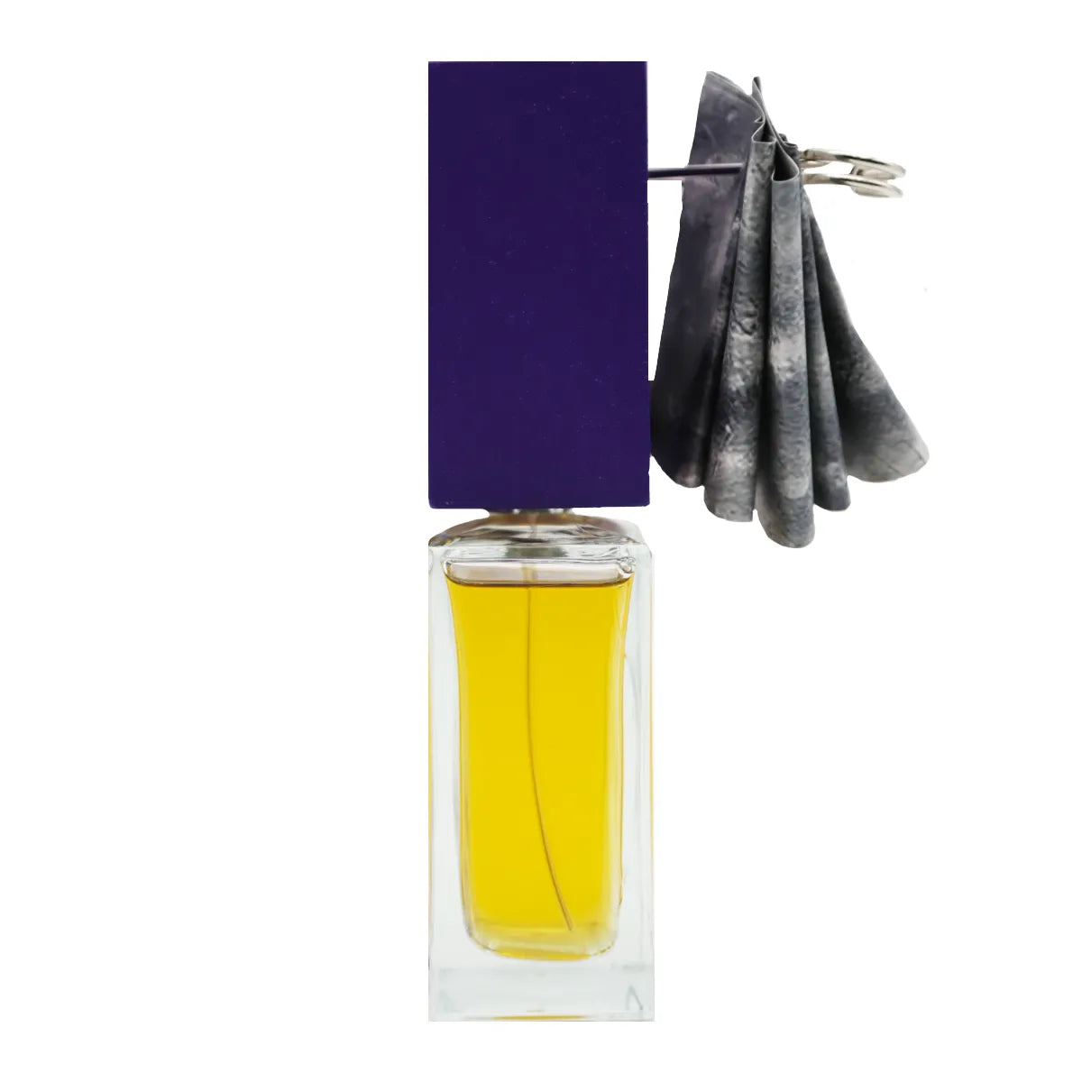 Filippo Sorcinelli - Unum - Oceano Viola zeigt klaren Flakon mit tiefviolettem Deckel und dekorativem Anhänger