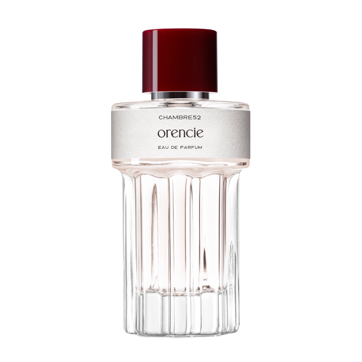 Chambre52 - Orencie zeigt klaren Flakon mit zart rosa Parfum und tiefrotem Verschluss vor weißem Hintergrund