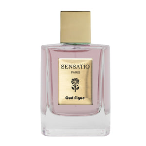 Sensatio Paris - Oud Figue Parfumflakon mit goldfarbenem Etikett und klarem Glas gefüllt mit rosa Flüssigkeit vor weißem Hintergrund