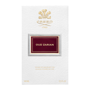 Creed - Oud Zarian elegante weiße Verpackung mit goldener Prägung und dunkelrotem Label in schlichtem Design