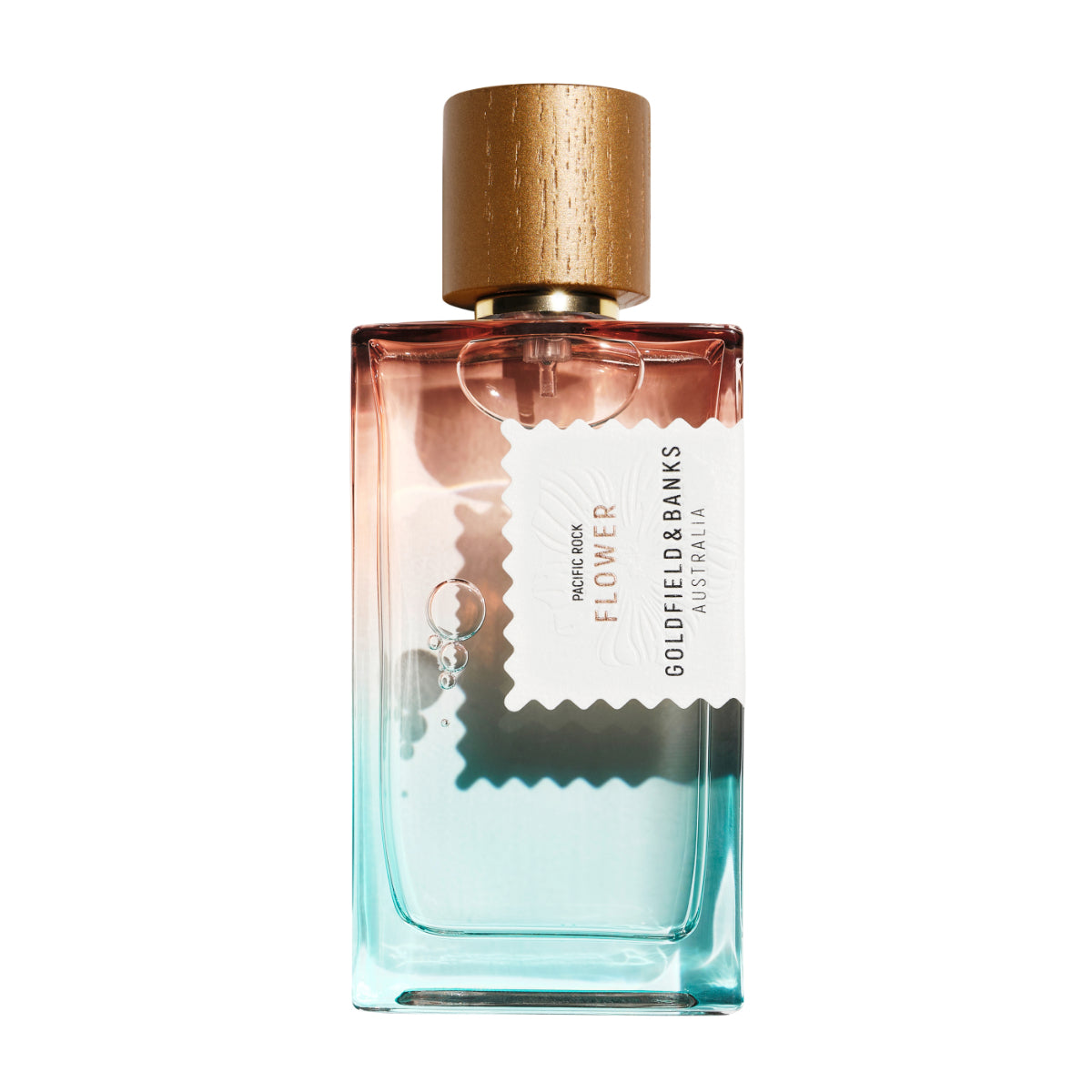 Goldfield & Banks - Pacific Rock Flower Parfumflakon mit Farbverlauf von Türkis zu Rosé und Holzdeckel auf weißem Hintergrund