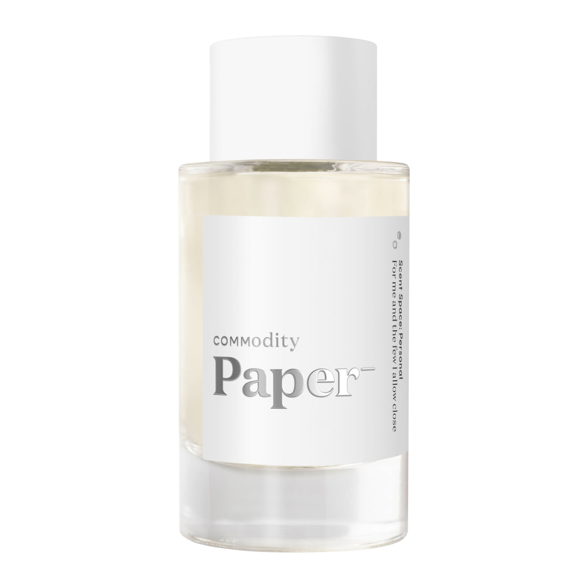 Commodity - Paper- Parfumflakon mit weißem Etikett und klarem, minimalistischen Design auf hellem Hintergrund