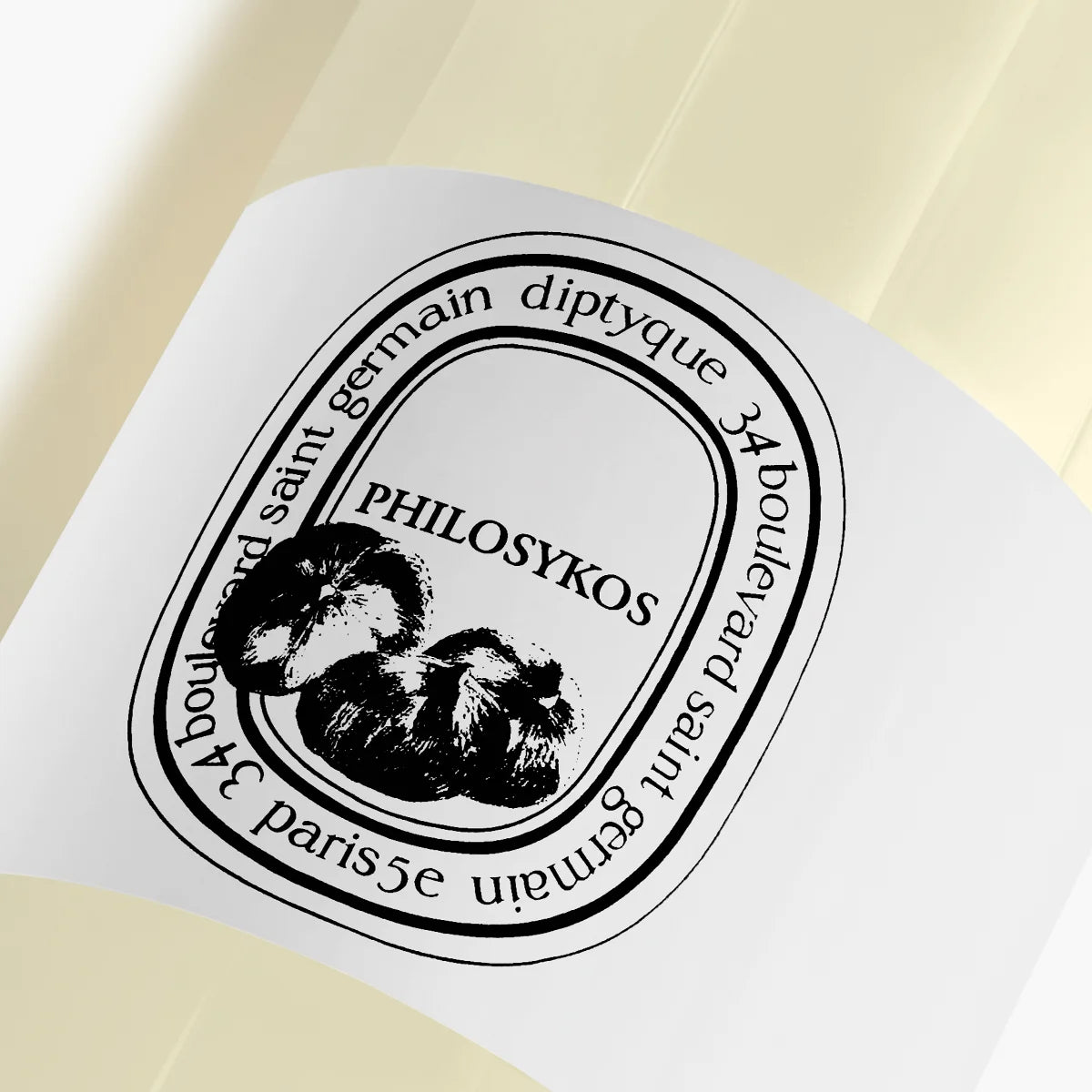 Diptyque - Philosykos - Cleansing Hand & Body Gel mit schwarzem Label auf transparenter Flasche, Nahaufnahme des Designs