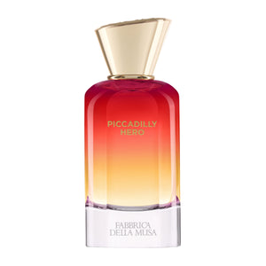 Fabbrica della Musa - Piccadilly Hero Parfumflakon mit Farbverlauf von Rot zu Gelb und goldfarbenem Deckel vor weißem Hintergrund