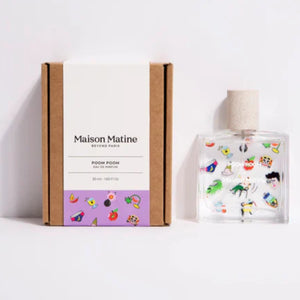 Maison Matine - Poom Poom Parfumflakon mit bunten, verspielten Miniaturillustrationen auf klarem Glas neben schlichter Verpackung