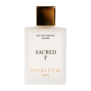 Spiritum - Sacred F Parfumflakon aus mattiertem Glas mit goldfarbenem Verschluss vor weißem Hintergrund