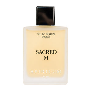 Spiritum - Sacred M Parfumflakon in mattiertem Glas mit schwarzem Verschluss und edlem minimalistischen Design vor weißem Hintergrund