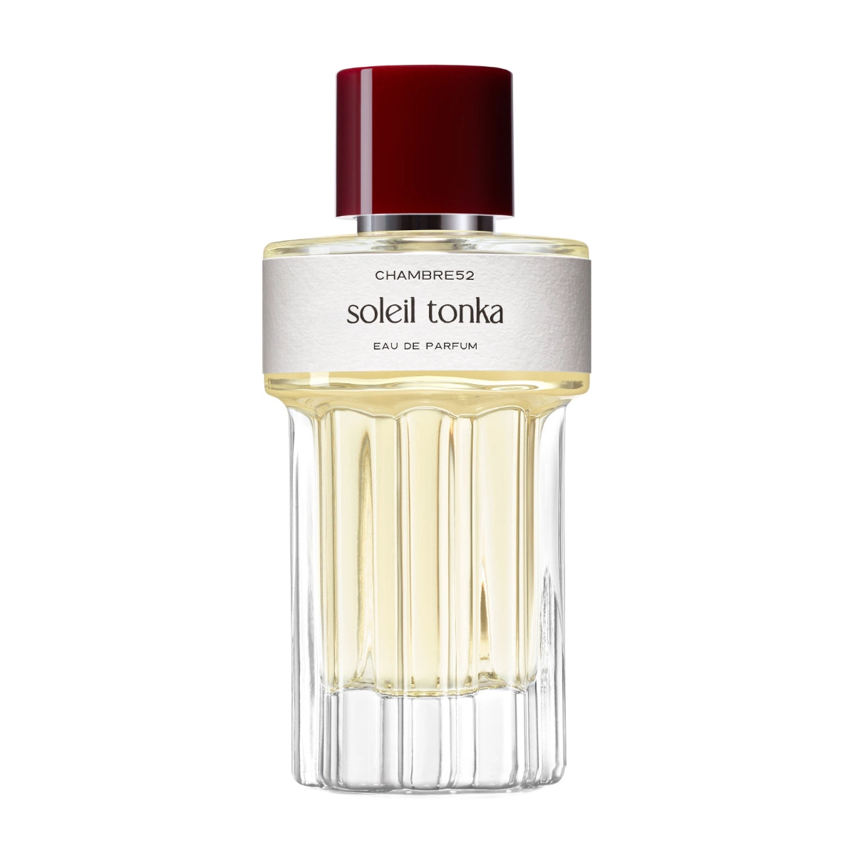Chambre52 - Soleil Tonka zeigt eleganten Duftflakon mit goldgelbem Parfum und rotem Deckel auf weißem Hintergrund