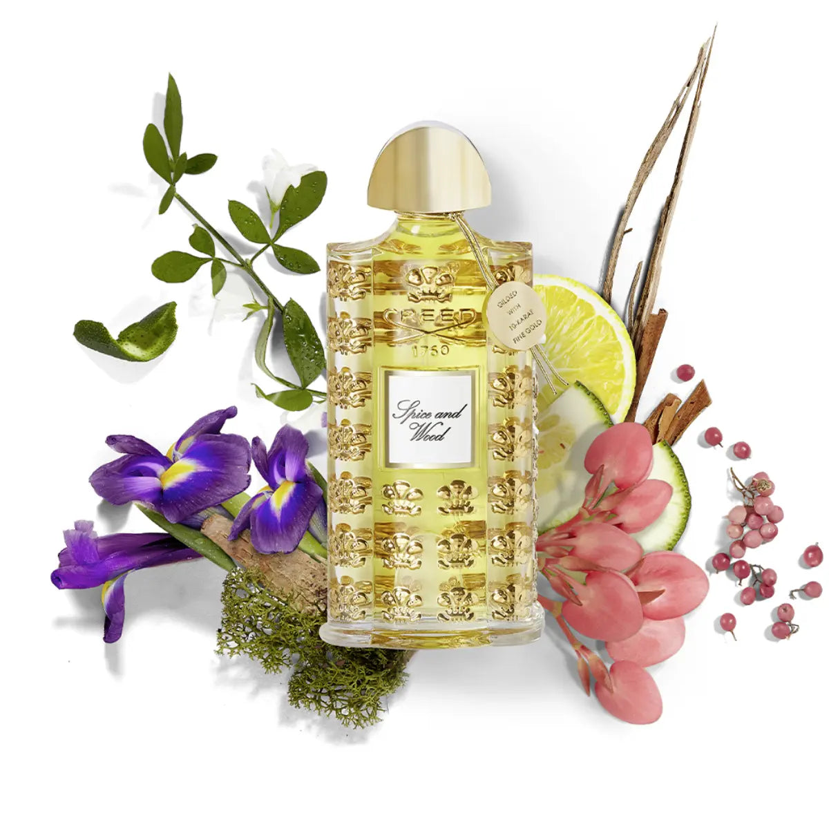 Creed - Les Royales Exclusives - Spice and Wood Parfumflakon mit goldener Kappe und edlem floralen Arrangement