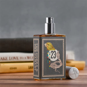 Imaginary Authors - The Cobra & The Canary in rechteckigem Glasflakon mit Vogel- und Schlangenmotiv auf dunklem Etikett