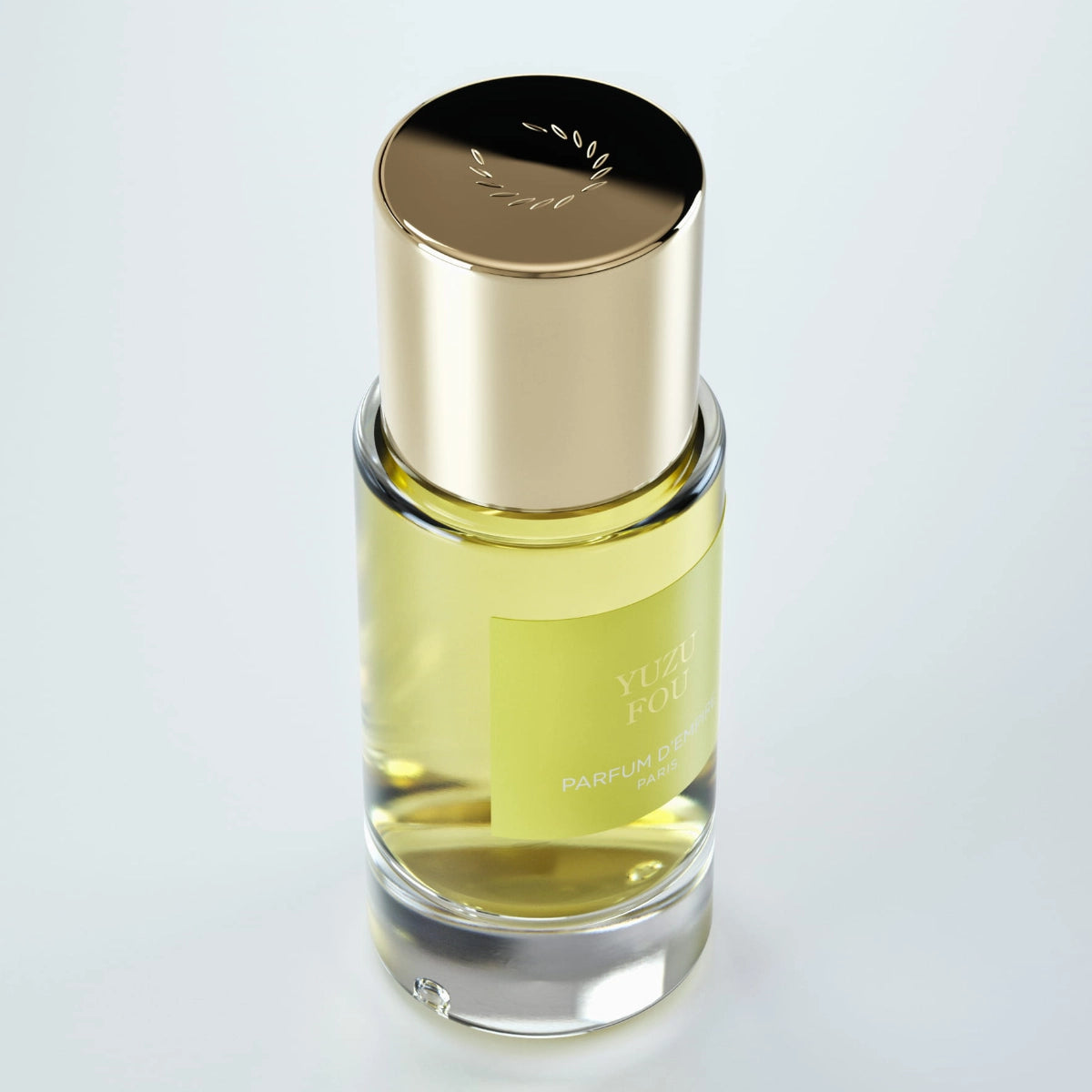 Parfum d'Empire - Yuzu Fou Duftflakon mit klarem Glas, goldfarbenem Deckel und hellgelbem Duftölfüllstand elegante Gestaltung