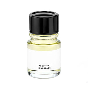 Headspace - Absinthe Parfumflakon mit hellem Inhalt und schwarzem Verschluss auf weißem Hintergrund