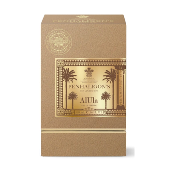 Penhaligon's - Trade Routes - AlUla Verpackung mit goldfarbenem Etikett und Palmenmotiv vor hellem Hintergrund