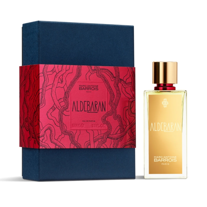 Marc-Antoine Barrois - Aldebaran Parfumflakon mit goldfarbenem Etikett neben dunkelblauer Geschenkbox mit rotem Aufdruck