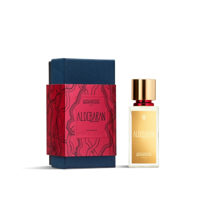 Marc-Antoine Barrois - Aldebaran Parfumflakon mit goldenem Verschluss neben dunkelblauer Geschenkbox mit rotem Etikett