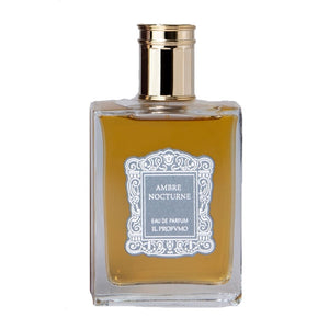 Il Profumo - Ambre Nocturne Parfumflakon mit bernsteinfarbenem Duft und goldenem Verschluss vor weißem Hintergrund
