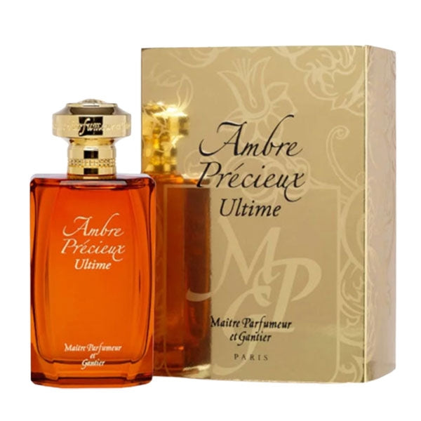 Maître Parfumeur et Gantier - Ambre Précieux Ultime Flakon in bernsteinfarbenem Glas mit goldfarbenem Verschluss vor goldener Verpackung